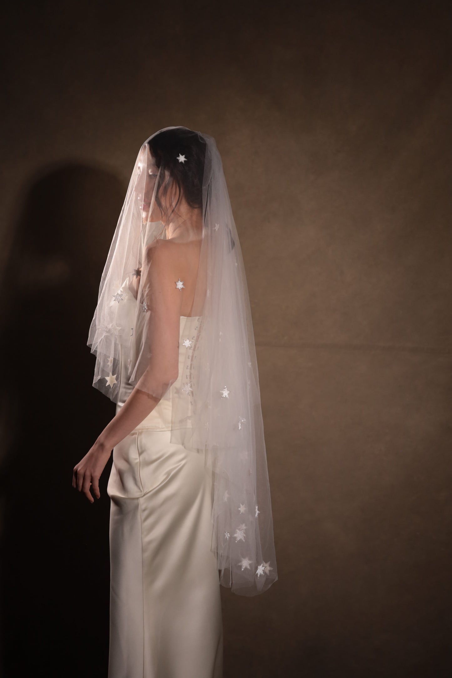 Two-tier bridal veil with blusher, adorned with glowing stars, crafted from soft French tulle in a soft white sheer hue, by Boom Blush.