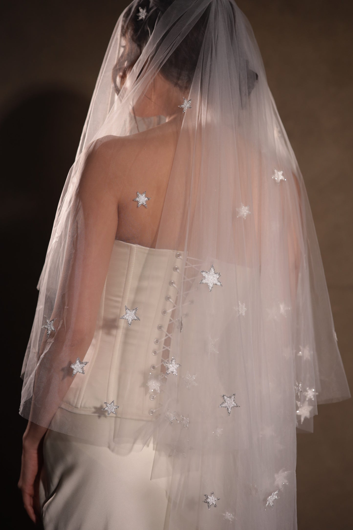 Two-tier bridal veil with blusher, adorned with glowing stars, crafted from soft French tulle in a soft white sheer hue, by Boom Blush.