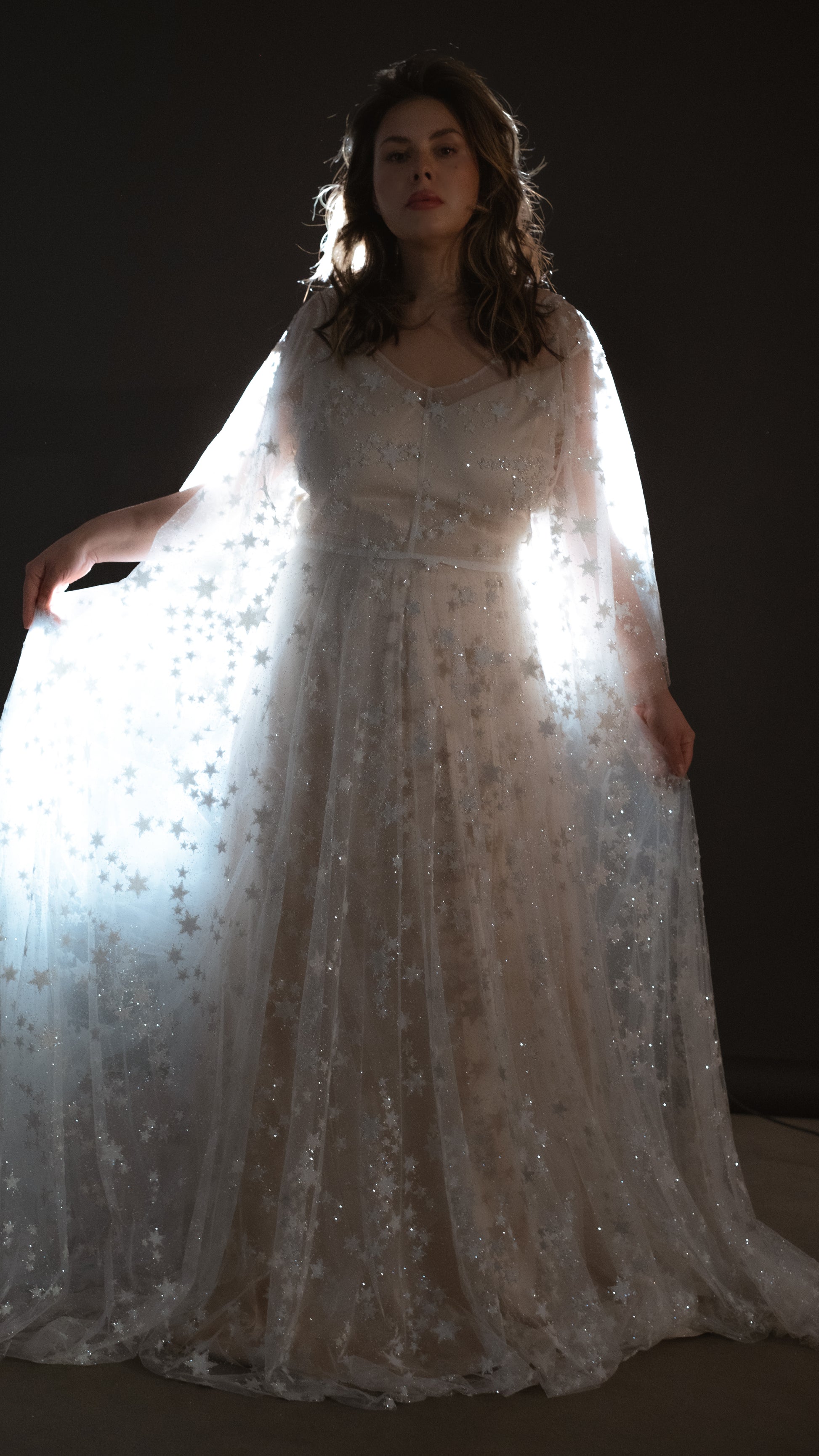 Boho plus size romantic bride in glow lace gown under sunset light