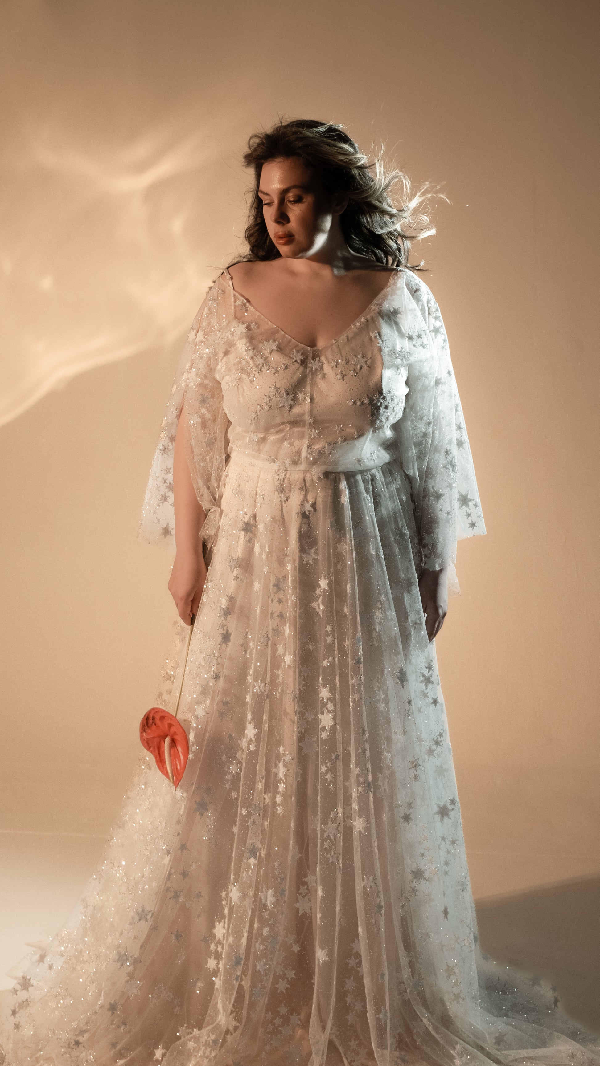 Boho plus size romantic bride in glow lace gown under sunset light
