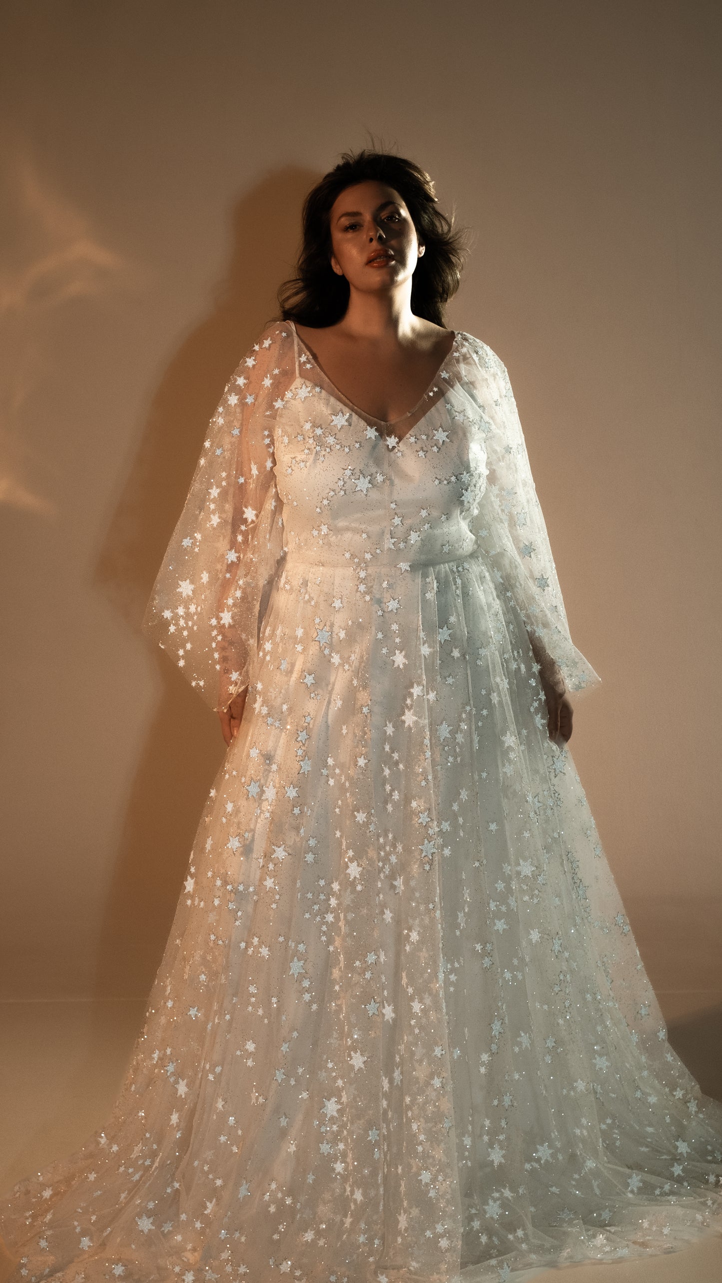 Boho plus size romantic bride in glow lace gown under sunset light