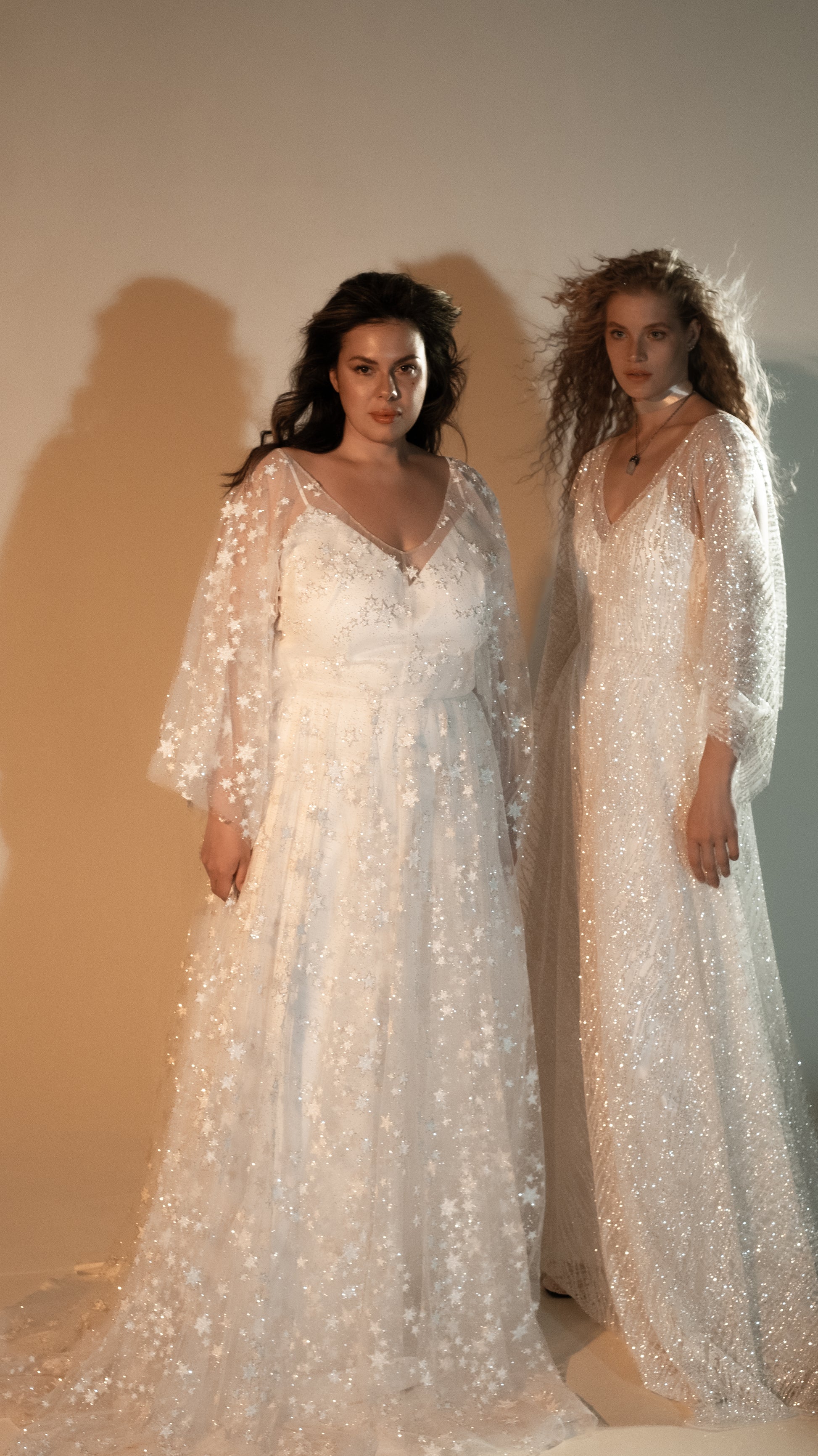 Two-piece ivory wedding dress with glowing star lace overlay plus size bride wearing romantic gown with veil and zodiac stars