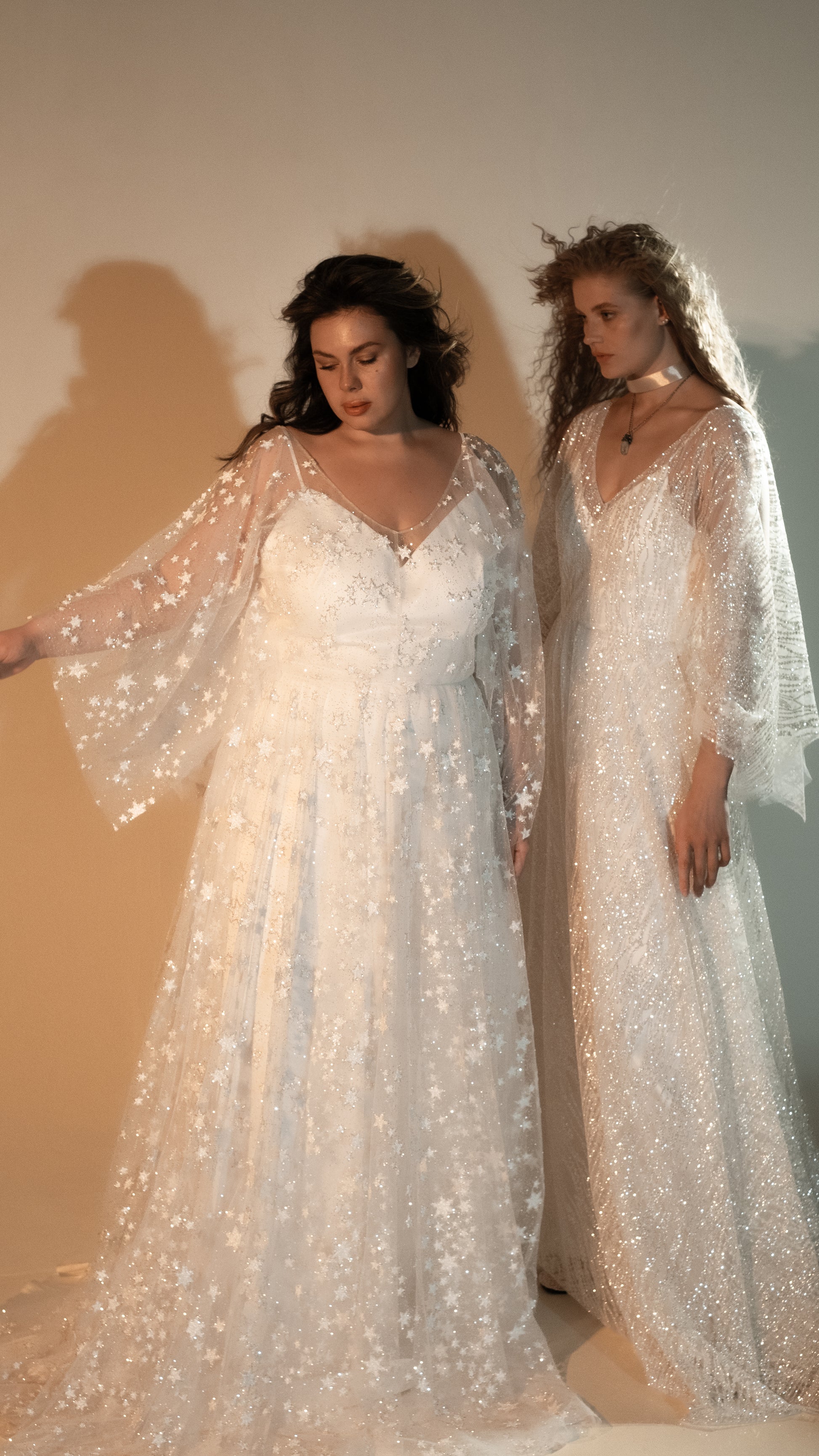 Two-piece ivory wedding dress with glowing star lace overlay plus size bride wearing romantic gown with veil and zodiac stars