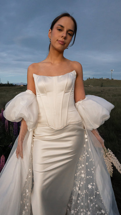 2026 2027 satin wedding dress with drop waist and puff sleeve cape, modern bridal outfit 