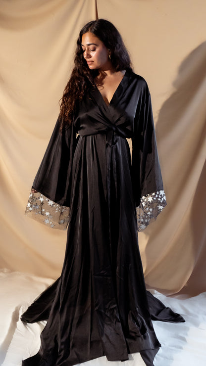 Bride wearing black bridal robe with stars and butterflies 
