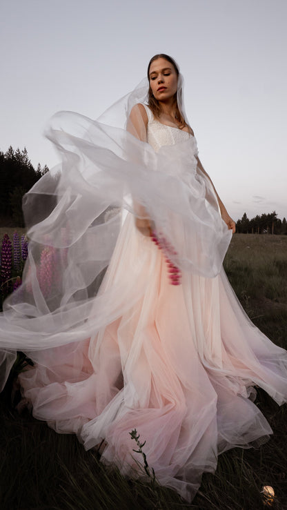 3-in-1 liquid super organza veil worn as a mantilla-style veil, neck scarf and editorial bridal veil with ultra-light finish