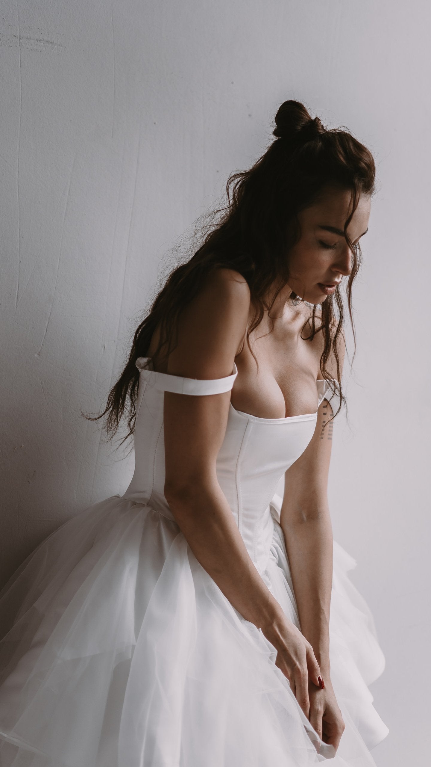 What can I do to conceal bottom of corset line in wedding gown